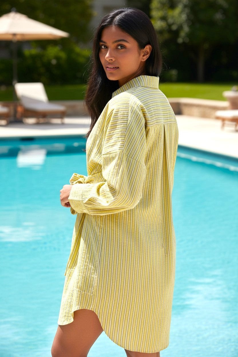 State of Georgia yellow and white striped linen blend shirt dress with collar and cuffed sleeves, worn by a model by a pool.